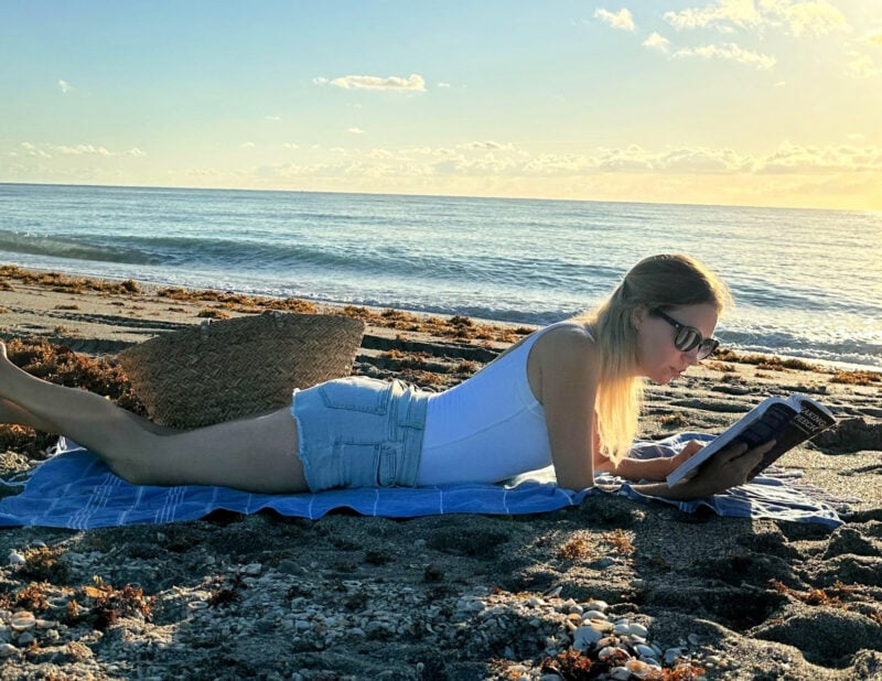 Ally on the beach reading