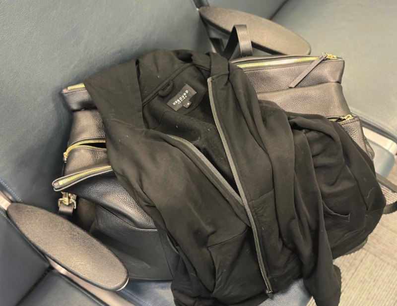 Long Flight Essentials: Your Ultimate Checklist unbound merino travel hoodie with the quince leather weekender