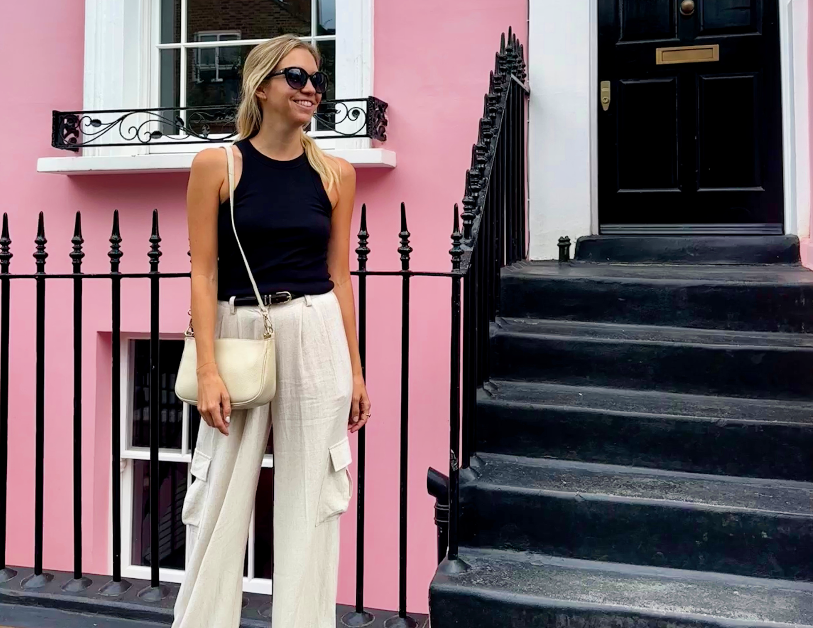 The Ultimate Packing List for Europe: By a Frequent Traveler Ally in front of colorful homes in Notting Hill London Summer