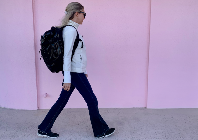 CALPAK Terra Backpack Review: Is It Ultimate Personal Item? ally wearing the calpak terra 26l duffel backpack on a trip 2