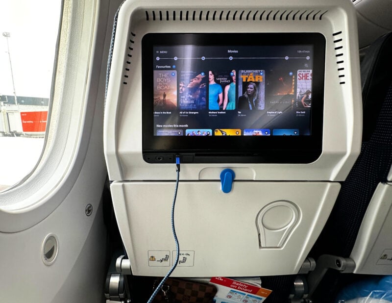 How to Survive a Long Haul Flight in Economy: A Step-by-Step Guide WATCHING A MOVIE ON A PLANE