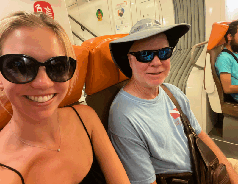 Ally and her dad on the train in the south of france