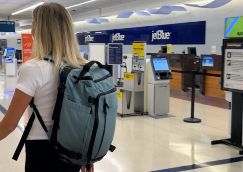 BAGSMART Blast Backpack Review: Best Budget Travel Backpack? ALLY WEARING THE BAGSMART BLAST BACKPACK AT THE AIRPORT