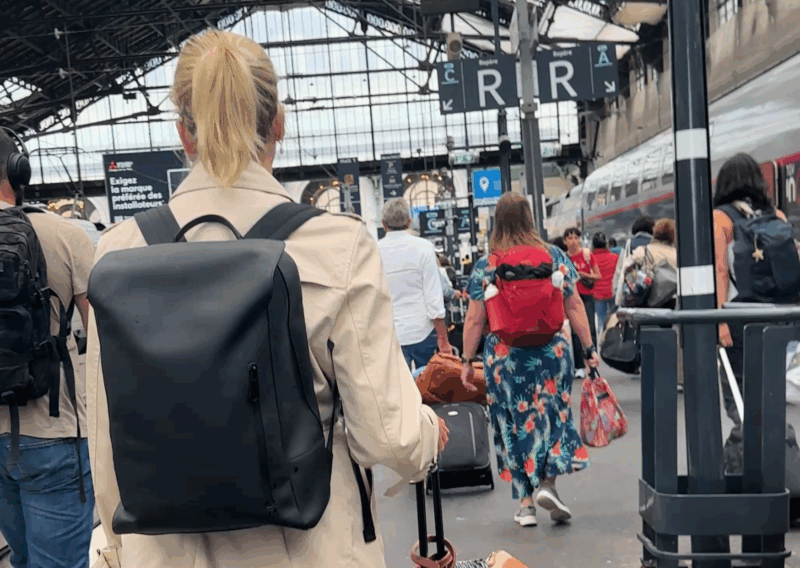Ally at Gare de Lyon in Paris wearing the Vista Backpack from Maverick & co.