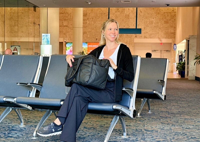 The Best Carry-On Luggage For Women: 2026 Round-Up Ally traveling with the CALPAK Luka duffel at Palm Beach International Airport