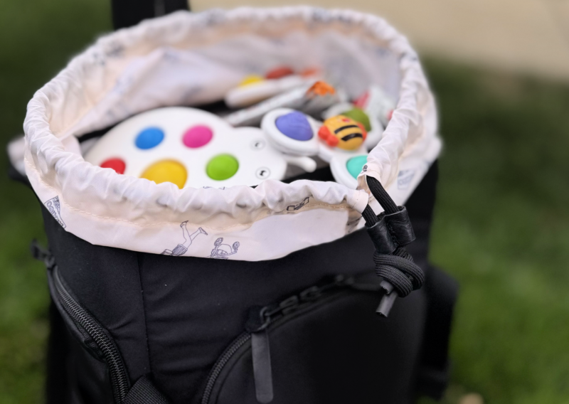 No Reception Club Getaway Bag Review: Easy Travel for Parents toy storage inside the No Reception Club Getaway Backpack Review