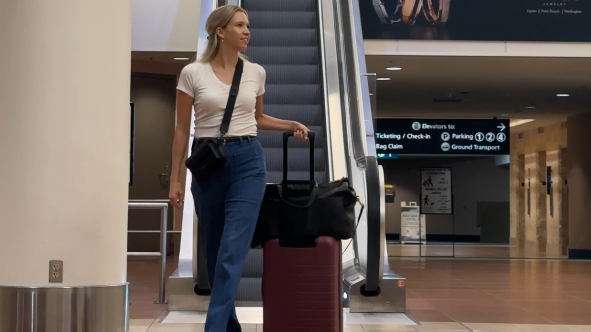 ally traveling with the quince carry-on and leather weekender