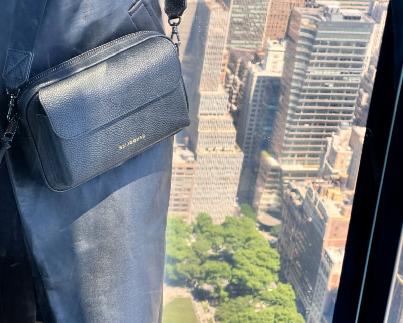 Bandolier Miller Bag Review: The Best Travel Crossbody Bag? ally travels bandolier miller crossbody above new york