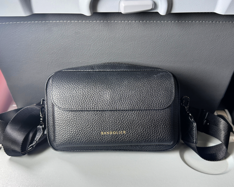 Bandolier Miller Bag Review: The Best Travel Crossbody Bag? bandolier miller crossbody on a plane - ally travels - travel crossbody