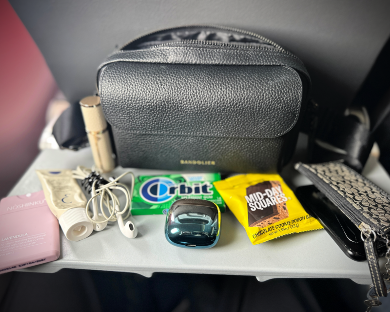Bandolier Miller Bag Review: The Best Travel Crossbody Bag? bandolier the miller crossbody with all my in-flight essentials