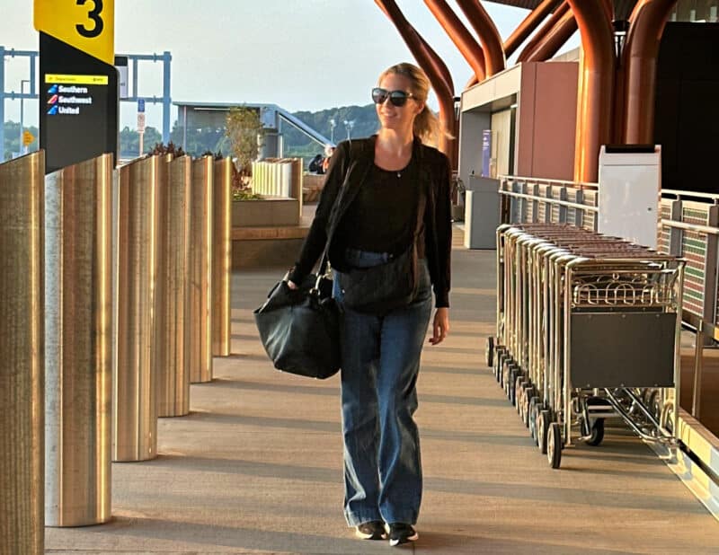 ally at there airport with the quince leather weekender