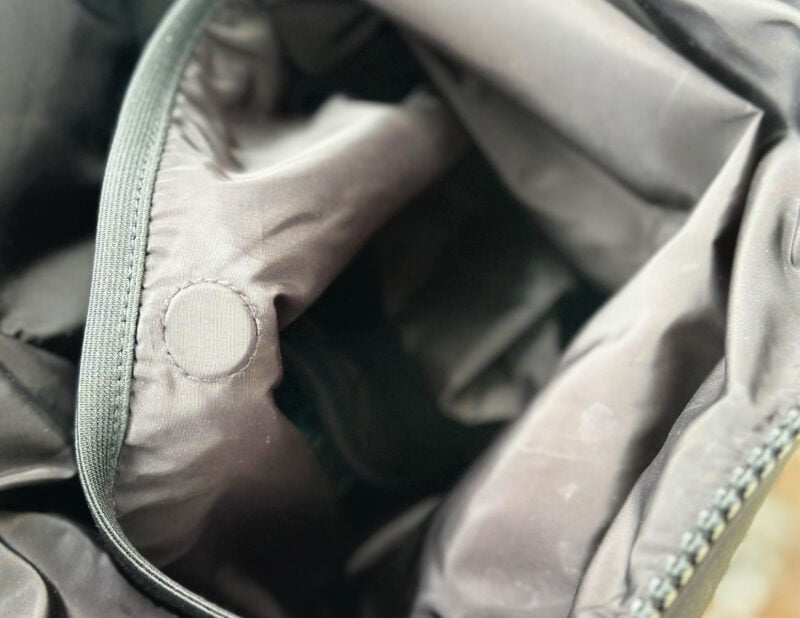 Dagne Dover vs. No Reception Club: Best Travel Diaper Bag? magnetized button - inside the Dagne dover indi backpack