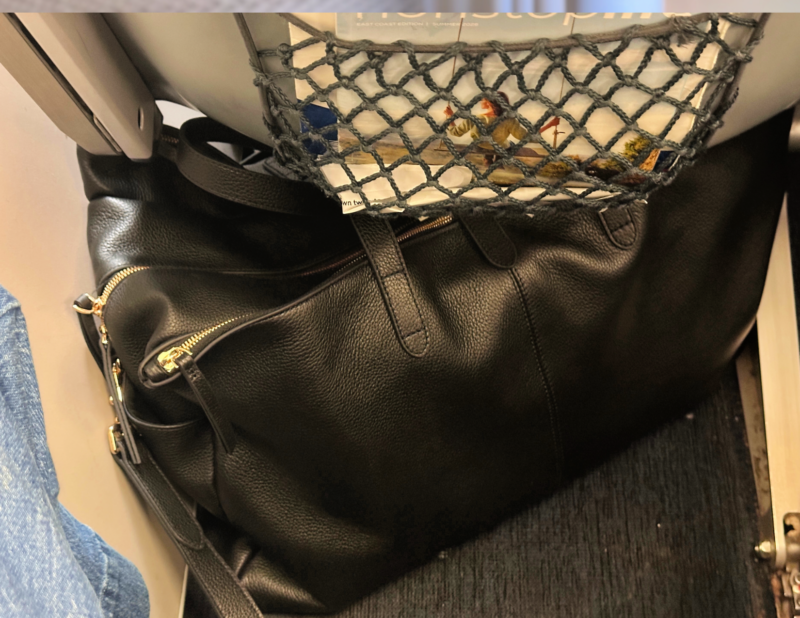 Quince Italian Leather Weekender Review: Worth It? quince leather weekender under the airline seat