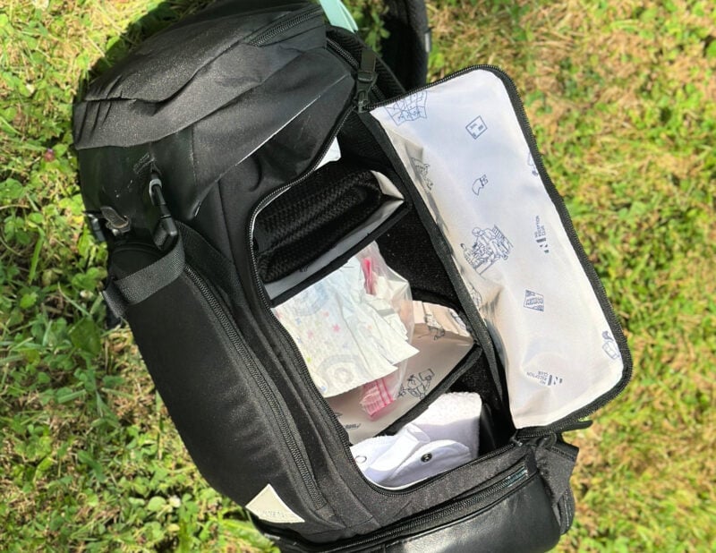 Dagne Dover vs. No Reception Club: Best Travel Diaper Bag? shelving on the no reception club backpack