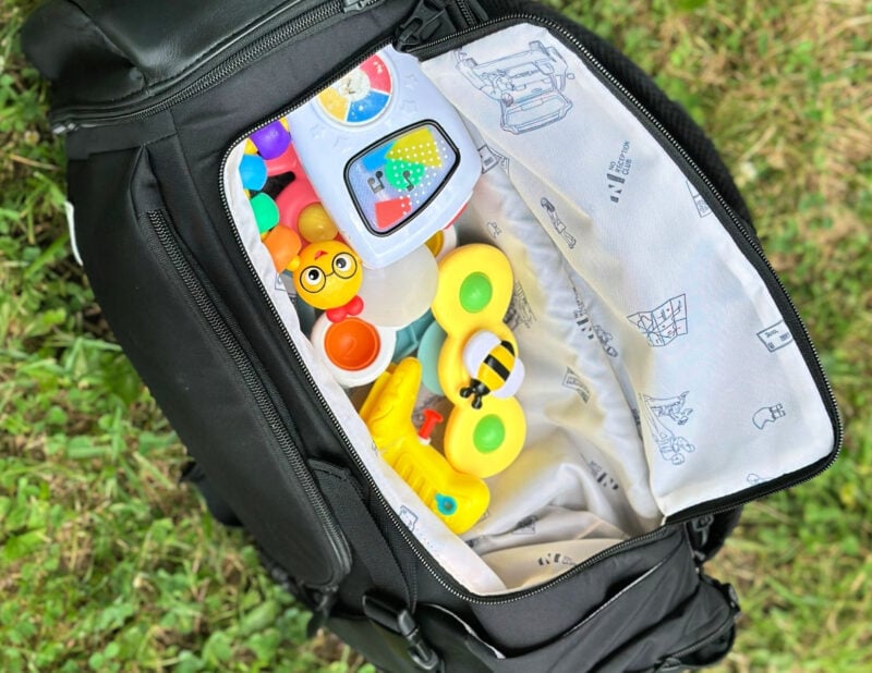 Dagne Dover vs. No Reception Club: Best Travel Diaper Bag? toy compartment no reception club