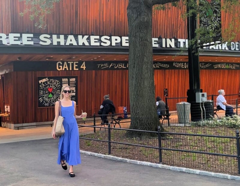 Shakespeare in the Park NYC: Your 2026 Guide to Free Theater ally walking with her matcha outside of free shakespeare in the park - ---