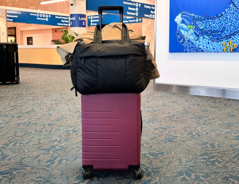 Calpak Luka vs Terra: Which Travel Bag Is Best for You? quince carry-on with the calpak luka duffel at pbi airport