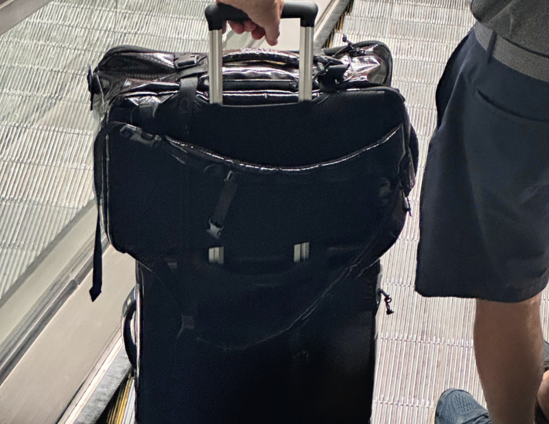 Calpak Luka vs Terra: Which Travel Bag Is Best for You? CALPAK TERRA BACKPACK ON TERRA SUITCASE IN PBI AIRPORT-2